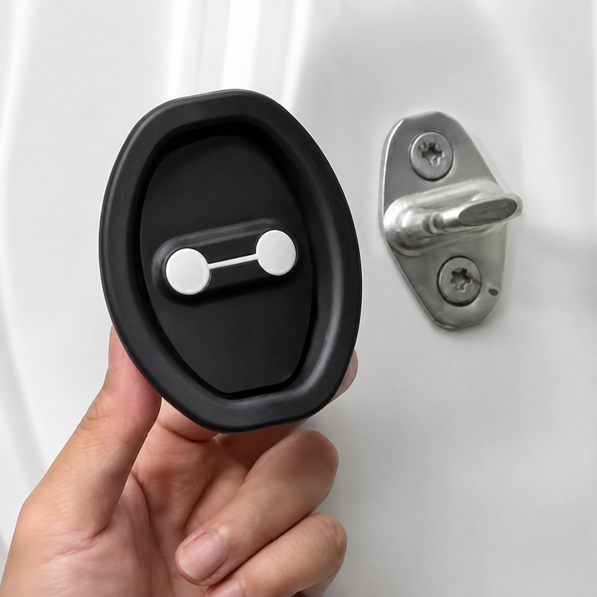 Silicone door lock damper next to the original car door striker